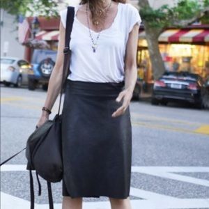 Perfect condition. Black leather. Made in small NYC boutique. Short skirt